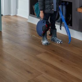 a kid tracking in snow on sheet vinyl flooring